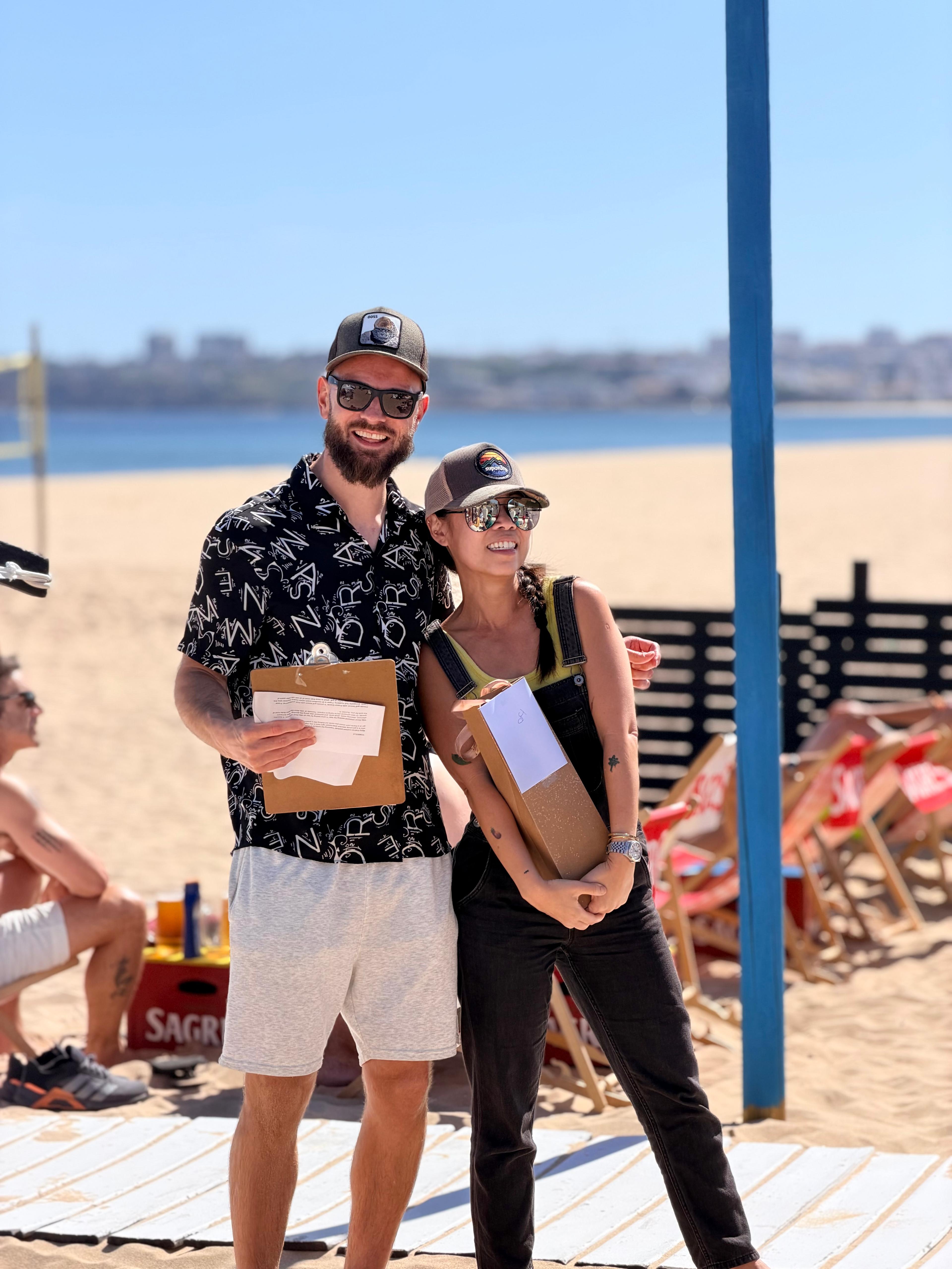 A couple posing with their prize box.
