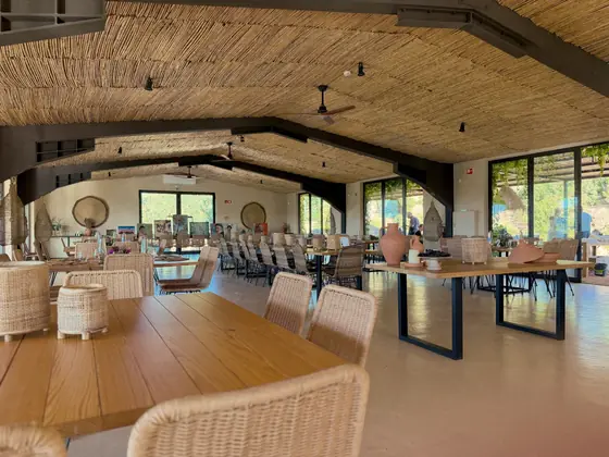 The long dining table prepared inside Arvad Vineyard for Vine and Fire.