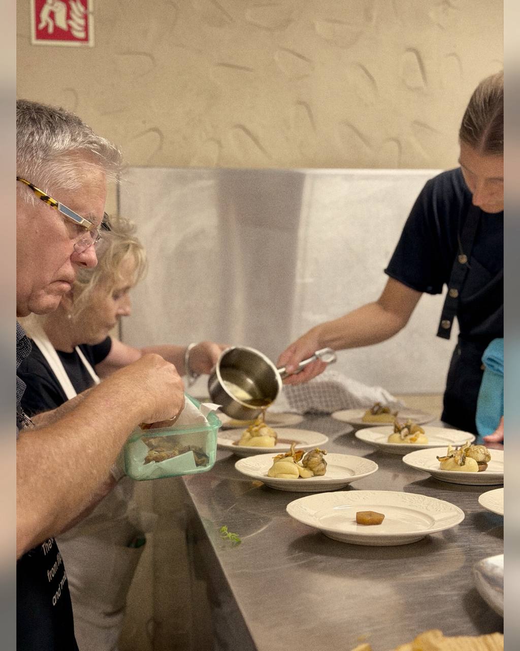 The Vine and Fire team plating dinner during the fundraiser at Arvad Vineyard